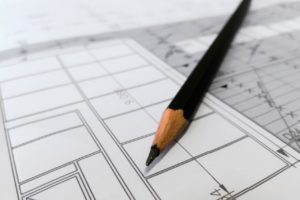 architectural glass finishes included in architect schematic with pencil and paper